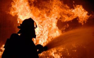 A man trying to settle down the fire