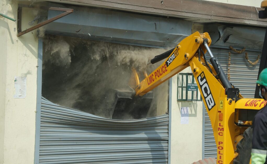 Bulldozer demolishing illegal structure in Lalitpur area