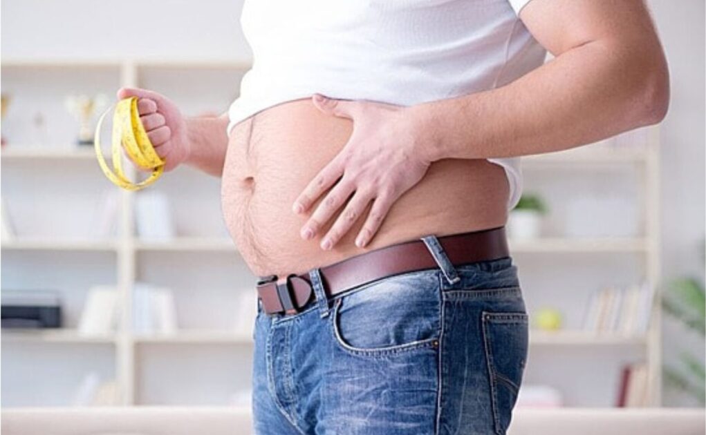 man measuring his weight.