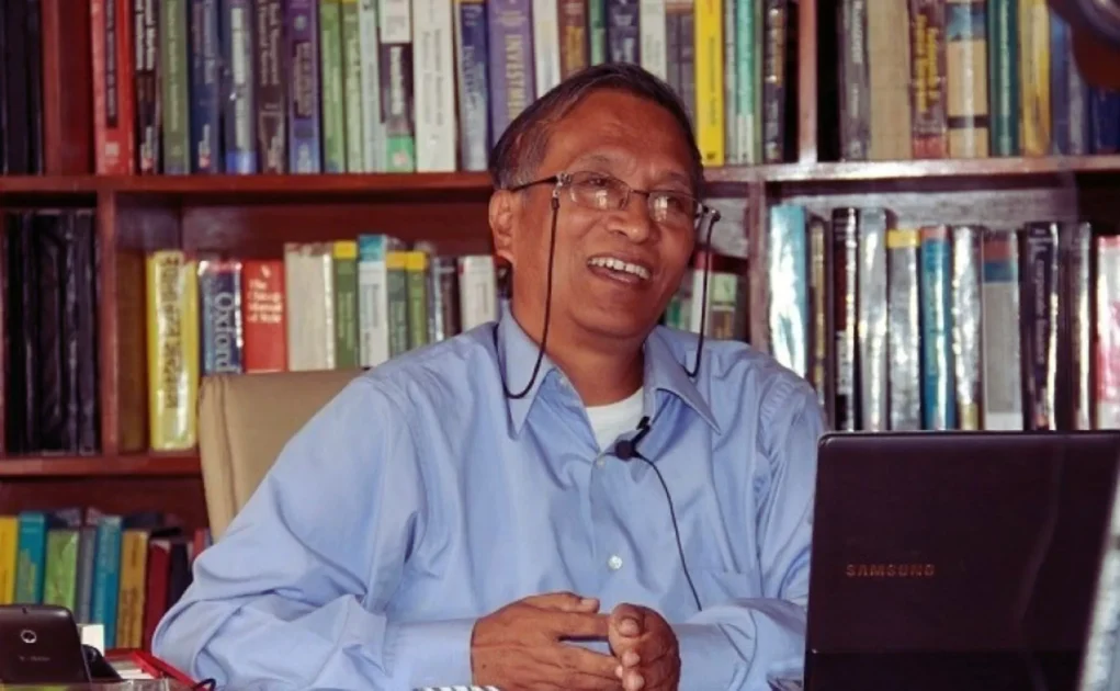 Dr. Keshar Jung Baral woking in his office
