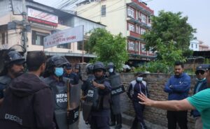 policemen trying to control the protest