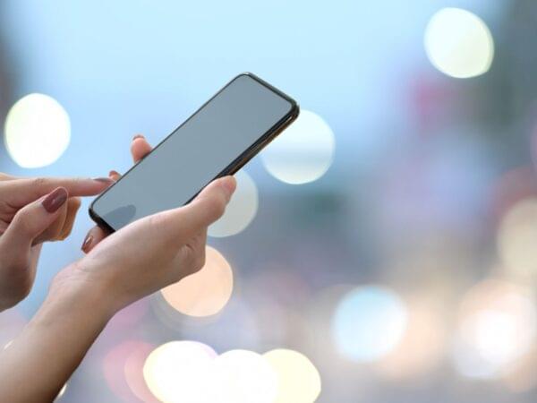 a person using best mobile phones under 15000 in Nepal